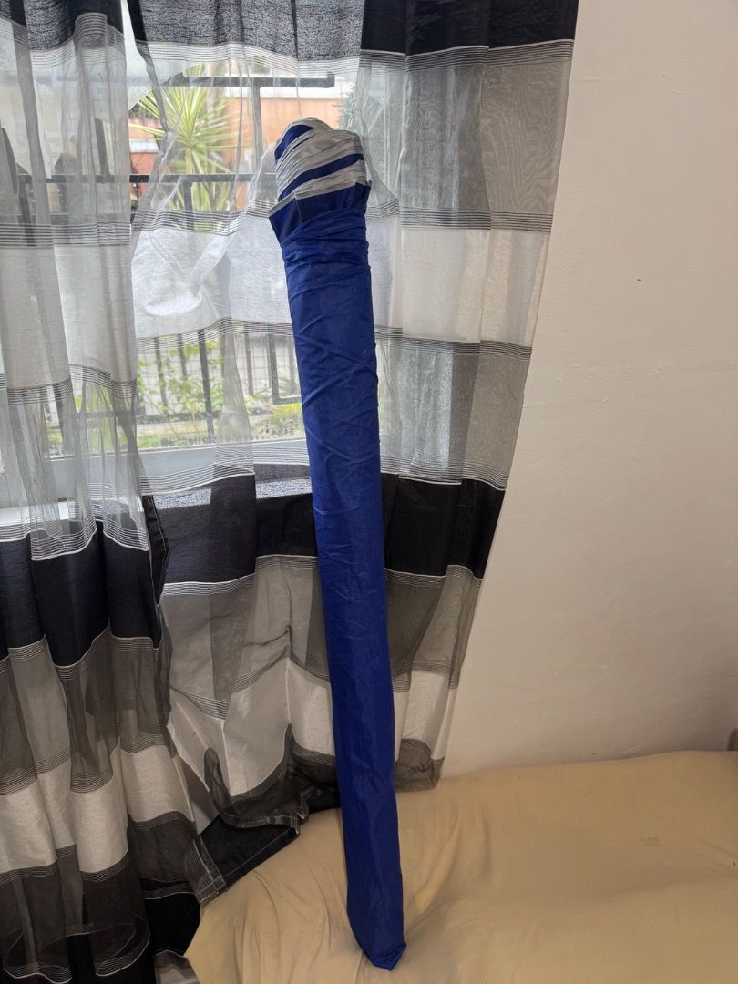 Beach Umbrella - Blue and Silver (Category: Umbrellas) located in Cavite. Submitted by royaleagle-7269 (Listing ID 1414787138, Image 1). Description: - Vibrant blue and silver color scheme - Sturdy white pole - Wide canopy for maximum shade - Folds up for easy storage and transport - Ideal for beach and park use - Provides sun protection.