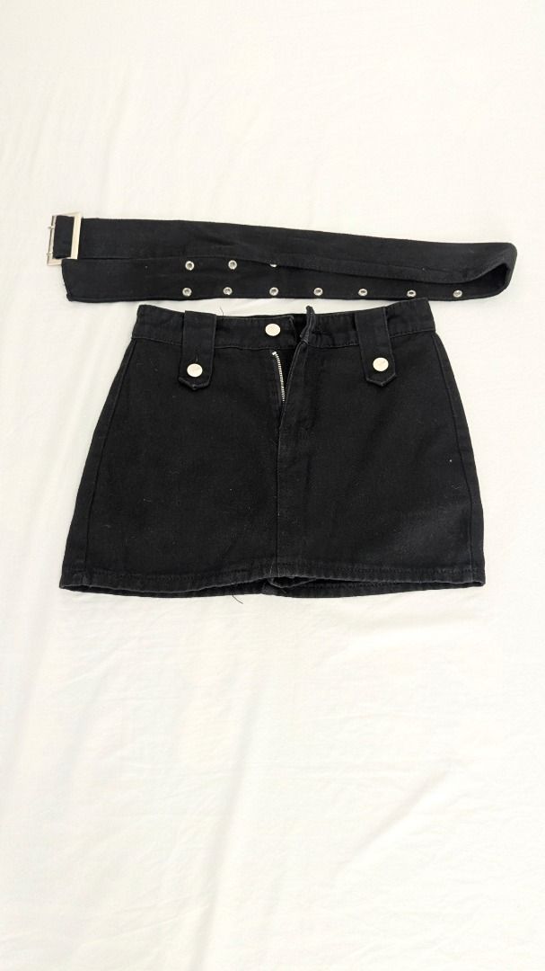 Black Denim Mini Skirt with Belt (Category: Skirts) located in Caloocan City. Submitted by dorbueittus (Listing ID 1414762885, Image 1). Description: - Black denim mini skirt - Includes matching belt - Zipper closure - Decorative buttons - Silver-tone belt hardware - Dress up or down - XS-S size.