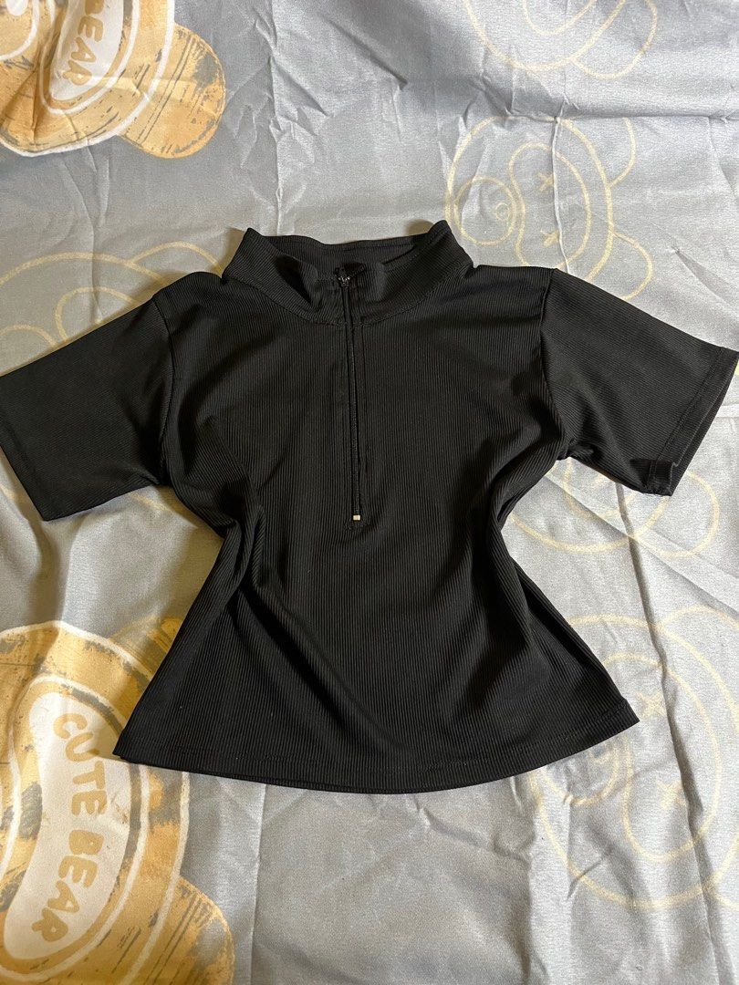black fitted cropped top (Category: Sleeveless) located in Manila. Submitted by a22bee (Listing ID 1414684649, Image 1). Description: - Black ribbed top - Short-sleeved - High neckline with zipper - Stretchy material - Dress up or down mop: gcash mod: lalamove, angkas padala, jnt - can meet around dlsu.
