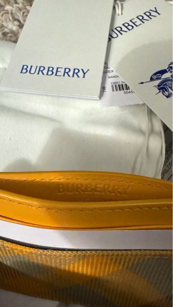 Burberry Card Holder (Category: Luxury Bags & Wallets) located in Manila. Submitted by Authentic_Seller (Listing ID 1414665834, Image 1). Description: Brand new Authentic Burberry card holder Yellow and plaid design Includes original tags and dust bag Multiple card slots Made in Italy with central note slot Warranty card, care card, leaflets.