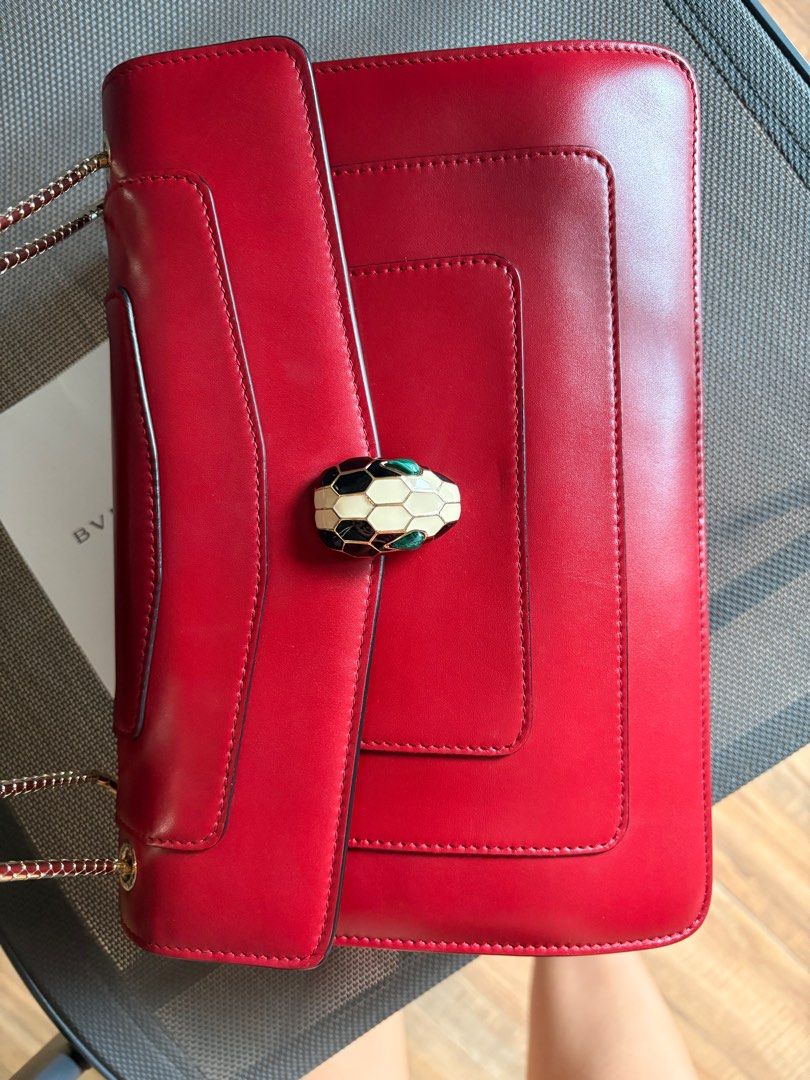 Bvlgari Serpenti Forever Shoulder Bag (Category: Luxury Bags & Wallets) located in Naga. Submitted by christinescollections (Listing ID 1414694065, Image 2). Description: - Bvlgari Serpenti Forever shoulder bag - Color: maroon red - Iconic snake head clasp - Includes: Dust bag, mirror, raincoat - Multiple interior compartments - Bvlgari logo embossed on the back Selling low.