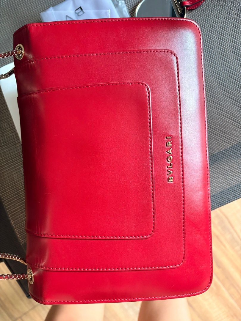 Bvlgari Serpenti Forever Shoulder Bag (Category: Luxury Bags & Wallets) located in Naga. Submitted by christinescollections (Listing ID 1414694065, Image 3). Description: - Bvlgari Serpenti Forever shoulder bag - Color: maroon red - Iconic snake head clasp - Includes: Dust bag, mirror, raincoat - Multiple interior compartments - Bvlgari logo embossed on the back Selling low.