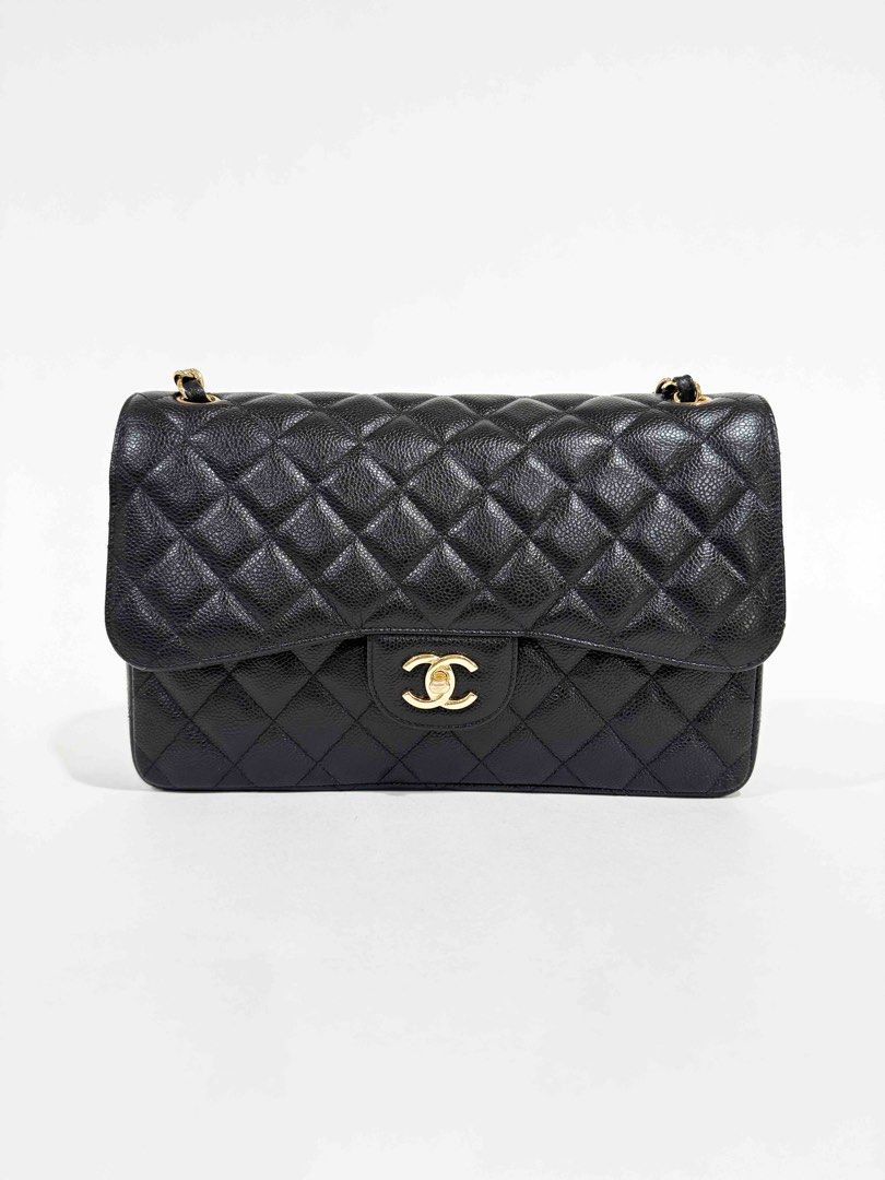 Chanel Classic Double Flap Jumbo Caviar (Category: Luxury Bags & Wallets) located in Pasig City. Submitted by shop_preloved_luxe (Listing ID 1414723885, Image 1). Description: - Authentic Chanel Classic Double Flap - Color: Black - Iconic quilted design - Gold-tone CC turn-lock closure - Interior: Main compartment and zippered pocket - Chain strap with leather detailing - Serial number visible/ Series 29 - Made in Italy RFS: owner is migrating .
