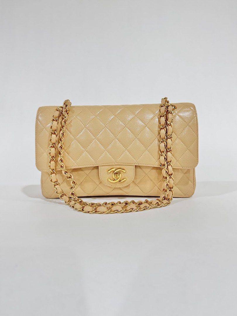 Chanel Classic Flap Bag Beige Caviar Medium (Category: Luxury Bags & Wallets) located in Pasig City. Submitted by shop_preloved_luxe (Listing ID 1414724641, Image 2). Description: - Authentic Chanel Classic Flap Bag medium - Crafted from beige caviar leather - Features quilted design - Signature CC turn-lock closure - Chain-link shoulder strap - Interior: main compartment and slip pocket - Includes serial number sticker/ Series 12 - Made in Franc