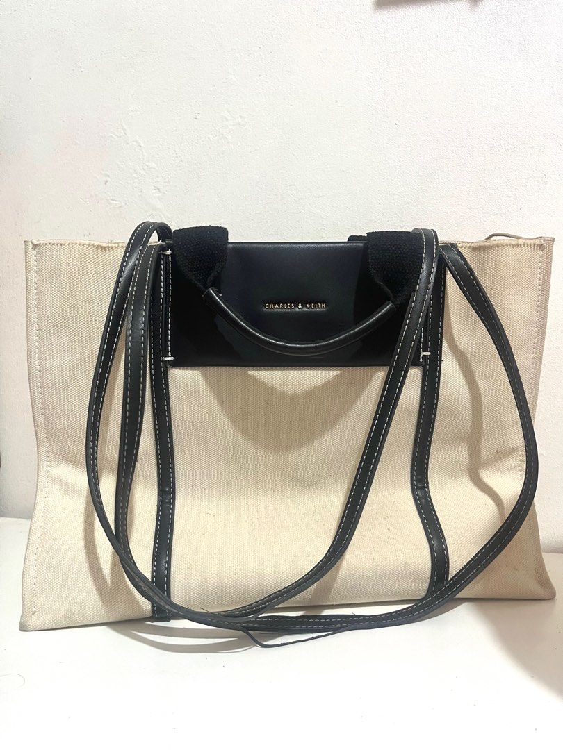 charles & keith shalia canvas tote bag (Category: Tote Bags) located in Muntinlupa City. Submitted by mikhasellsstuff (Listing ID 1414724611, Image 1). Description: — bought from @lovepochette on ig Please see close-up photos for minor flaws on the bag. These can be repaired with stitching. Item has not been washed..