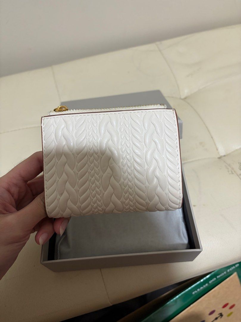 Charles & Keith White Braided Wallet (Category: Wallets & Card holders) located in Taguig. Submitted by ky_declutterss (Listing ID 1414653802, Image 2). Description: - Braided design - Zip-around and snap closures - Multiple interior compartments - Comes with original box - Good as new (only used it for one day lol) - Last price posted - RFS: impulse buy.