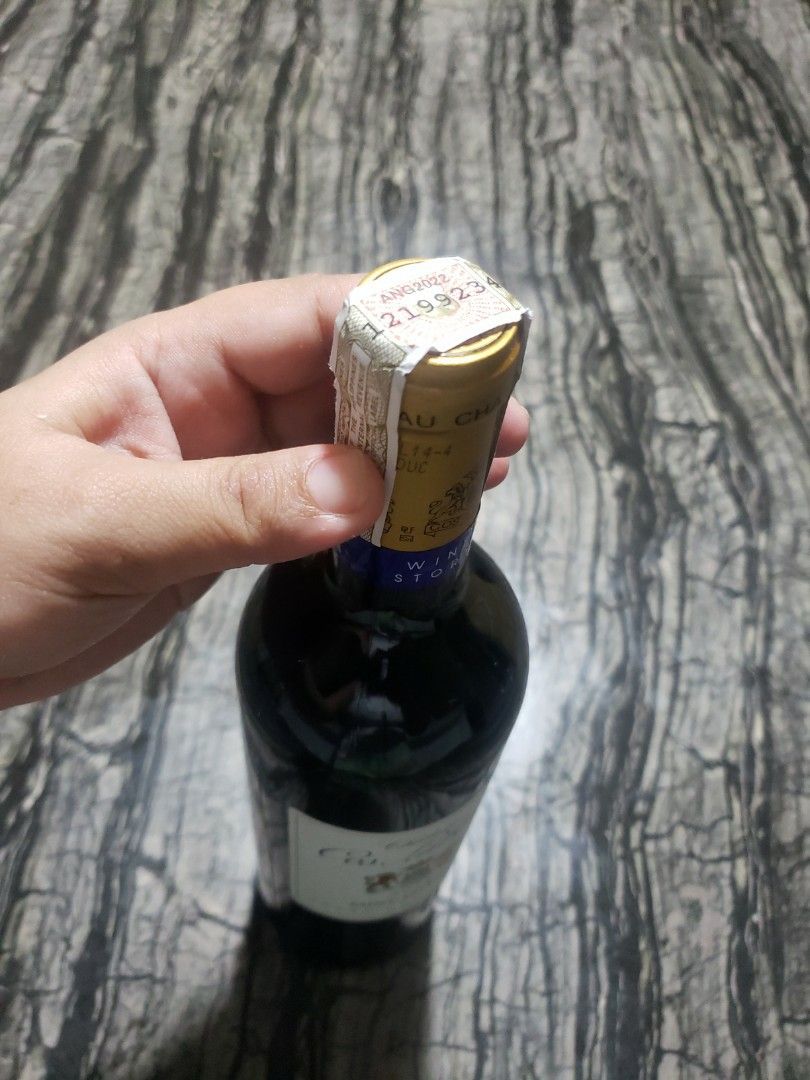 Chateau Cos Labory 2014 Saint Estephe (Category: Beverages) located in San Jose del Monte. Submitted by shegotit (Listing ID 1414738394, Image 2). Description: - Chateau Cos Labory 2014 Saint Estephe wine - Unopened bottle - Features a blue and gold label - Includes a 'Wine Story' neck label - Gold foil top with serial number.