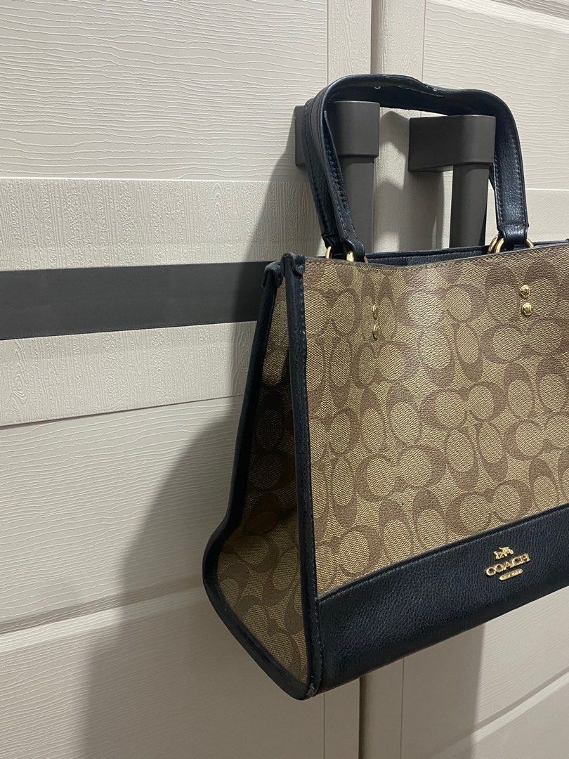 Coach Signature Tote Bag (Category: Luxury Bags & Wallets) located in Tacloban City. Submitted by luxefind12345 (Listing ID 1414668976, Image 2). Description: - Authentic Coach tote bag - Classic Coach monogram pattern - IDEAL zipper - Black leather base and handles - Top handle - Magnetic snap closure - Interior zip pocket - Gold-tone hardware - Includes Coach hangtag - Made in Indonesia.
