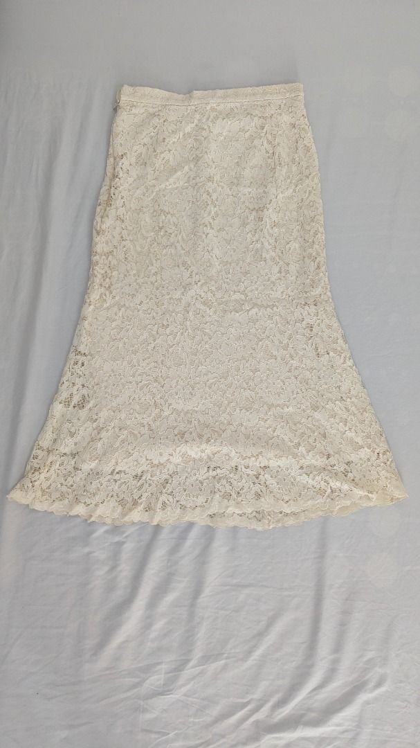 Cream Lace Skirt (Category: Skirts) located in Caloocan City. Submitted by dorbueittus (Listing ID 1414765915, Image 1). Description: - Cream-colored lace skirt - Fitted design - Flared hem - Delicate lace fabric - Perfect for special occasions.
