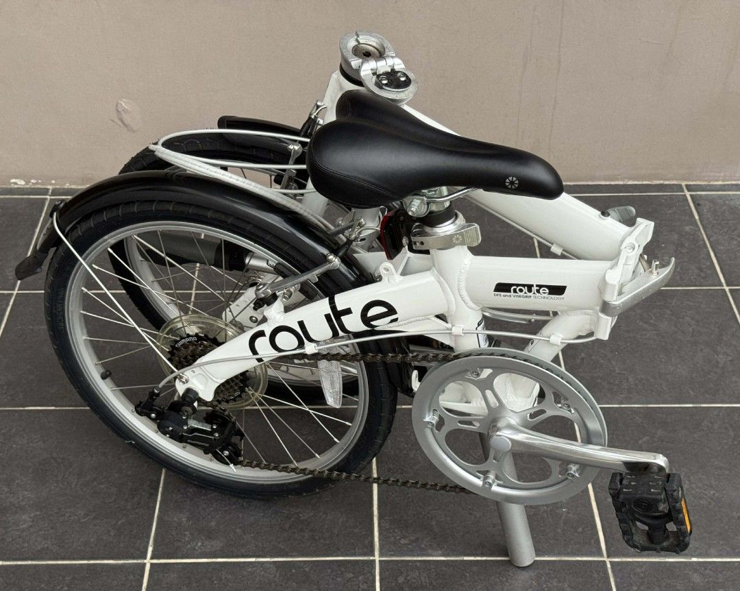 Dahon Route GLO Cloud White Folding Bike (Category: Bicycles) located in Las Pinas. Submitted by coolbear.1cc181 (Listing ID 1414637325, Image 3). Description: - White Dahon Route folding bike - 6-speed Microshift shifter - Includes fenders - Comfortable black seat - Folds for easy storage and transport - Dahon DFS and ViseGrip technology - Route logo on frame *** reasonably negotiable *** Please refrain from inquiring if 'available', it is, as l