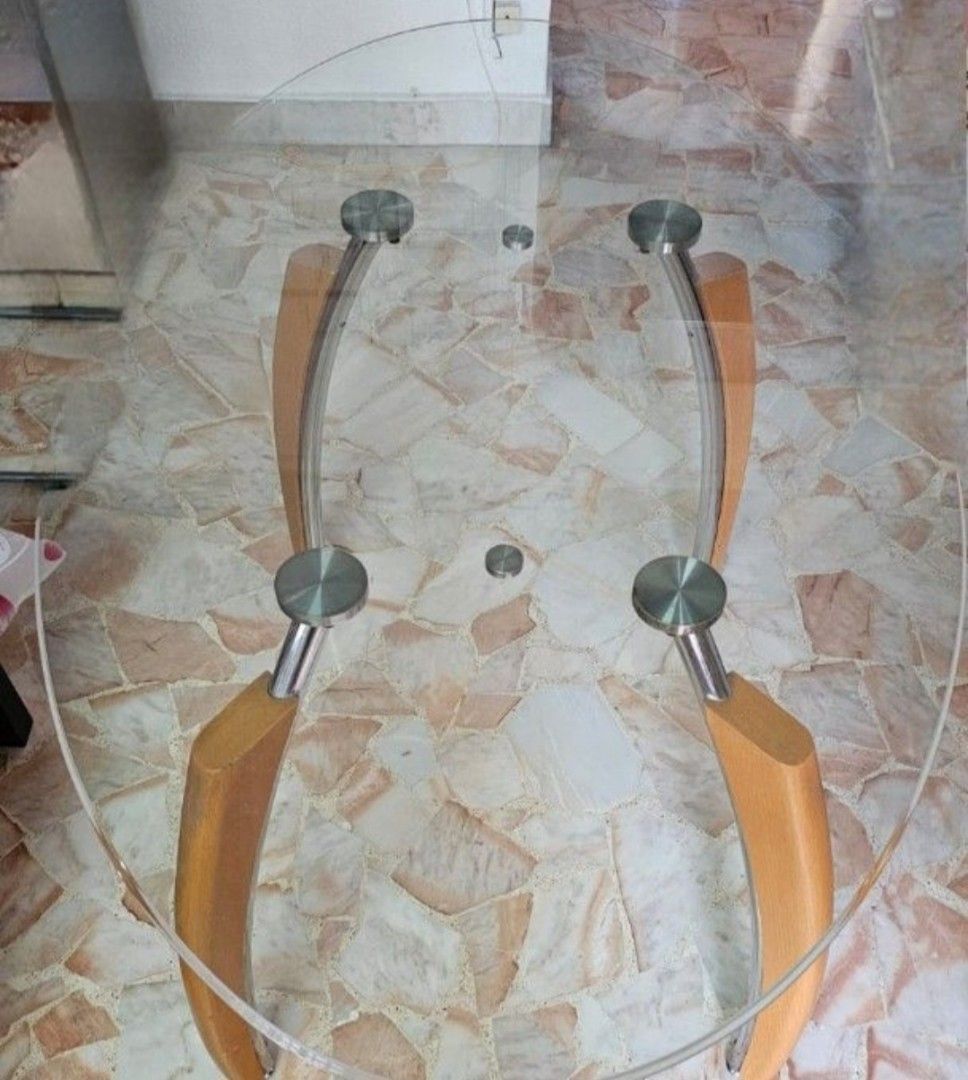 Dining Table (Category: Tables & Sets) located in Singapore. Submitted by ed_de_rick (Listing ID 1414653583, Image 2). Description: - Oval dining table - Clear glass top - Wooden legs - Dimensions: 137cm (L) x 81cm (W).