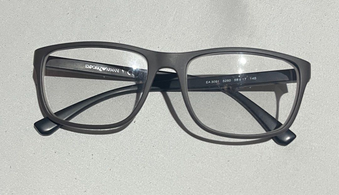 Emporio Armani Eyeglasses EA3091 (Category: Sunglasses & Eyewear) located in Makati City. Submitted by yulrox (Listing ID 1414823508, Image 3). Description: - Emporio Armani eyeglasses - Gray frame - Includes original case - Includes cleaning cloth - Includes small sealed packet - Model: EA3091 - Size: 52-17-145 - Clear lenses - Case features Emporio Armani logo.