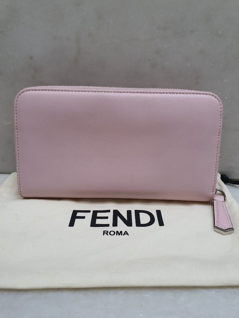Fendi Studded Zip Around Wallet (Category: Luxury Bags & Wallets) located in Santa Rosa. Submitted by pb_reg (Listing ID 1414635640, Image 3). Description: - Authentic Fendi wallet - Pink color - Colorful studded details - Zip-around closure - Multiple card slots and compartments - Includes dust bag - Pink interior - Fendi logo visible FOR TAKE ALL Please see individual posts for more photos 1. Louis Vuitton keepall 55 bandouliere - great conditi