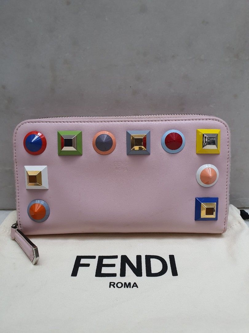 Fendi Studded Zip Around Wallet (Category: Luxury Bags & Wallets) located in Santa Rosa. Submitted by pb_reg (Listing ID 1414635640, Image 1). Description: - Authentic Fendi wallet - Pink color - Colorful studded details - Zip-around closure - Multiple card slots and compartments - Includes dust bag - Pink interior - Fendi logo visible FOR TAKE ALL Please see individual posts for more photos 1. Louis Vuitton keepall 55 bandouliere - great conditi