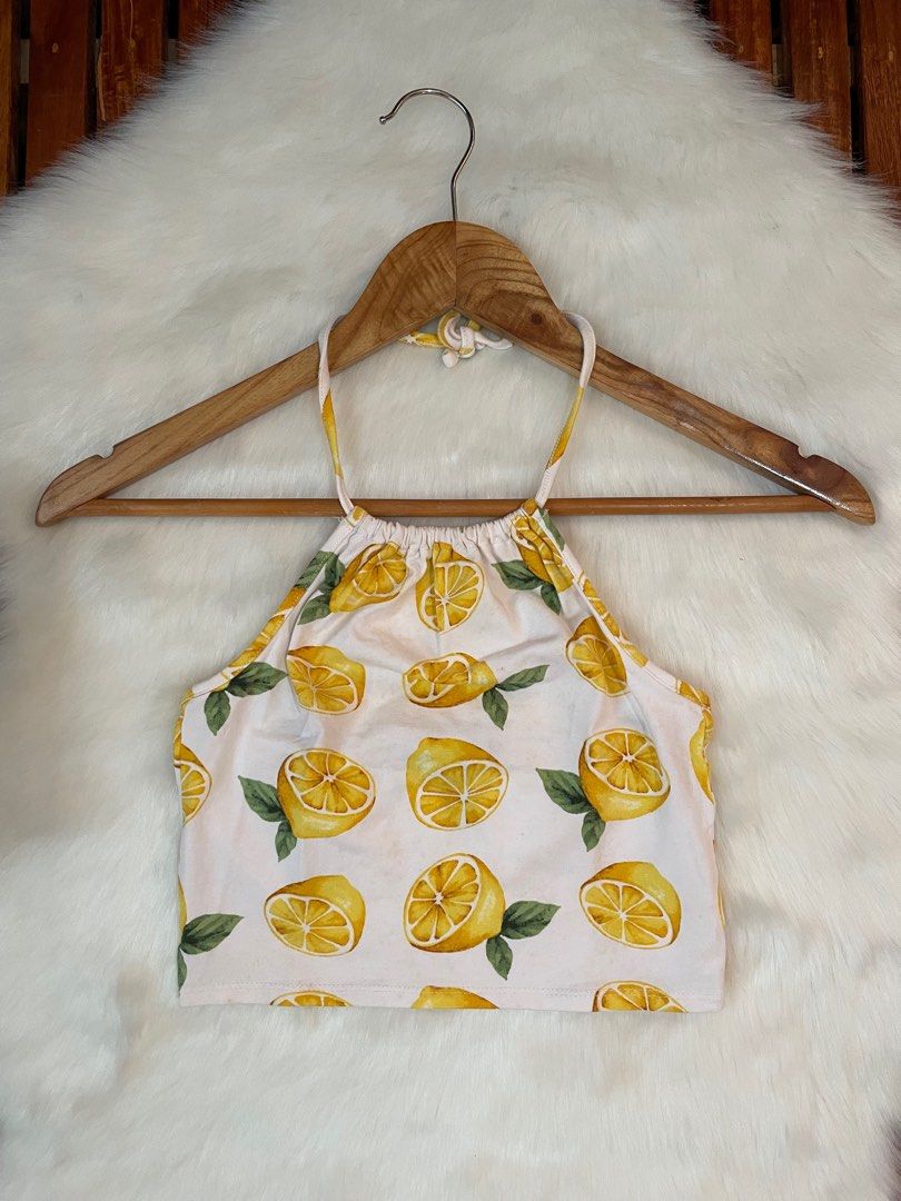 Forever 21 Lemon Print Crop Top (Category: Others Tops) located in Manila. Submitted by dbbjll (Listing ID 1414797901, Image 1). Description: - Forever 21 crop top - Features a vibrant lemon print - Stylish halter neck design - Size: Small.