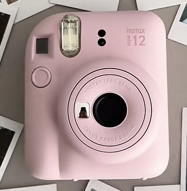 Fujifilm Instax Mini 12 - Pastel Pink (Category: Cameras) located in Butuan. Submitted by itsmel2624 (Listing ID 1414803666, Image 1). Description: - Fujifilm Instax Mini 12 (Pastel Pink) - Built-in flash - 60mm lens - Includes clear protective case - Comes with wrist strap - Sleek, rounded design - Ideal for instant memories With 5 extra film and battery Complete inclusions.