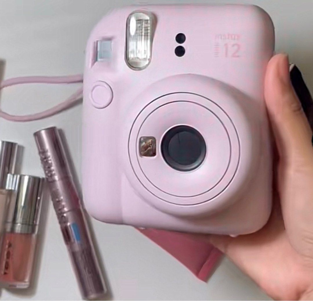 Fujifilm Instax Mini 12 - Pastel Pink (Category: Cameras) located in Butuan. Submitted by itsmel2624 (Listing ID 1414803666, Image 3). Description: - Fujifilm Instax Mini 12 (Pastel Pink) - Built-in flash - 60mm lens - Includes clear protective case - Comes with wrist strap - Sleek, rounded design - Ideal for instant memories With 5 extra film and battery Complete inclusions.