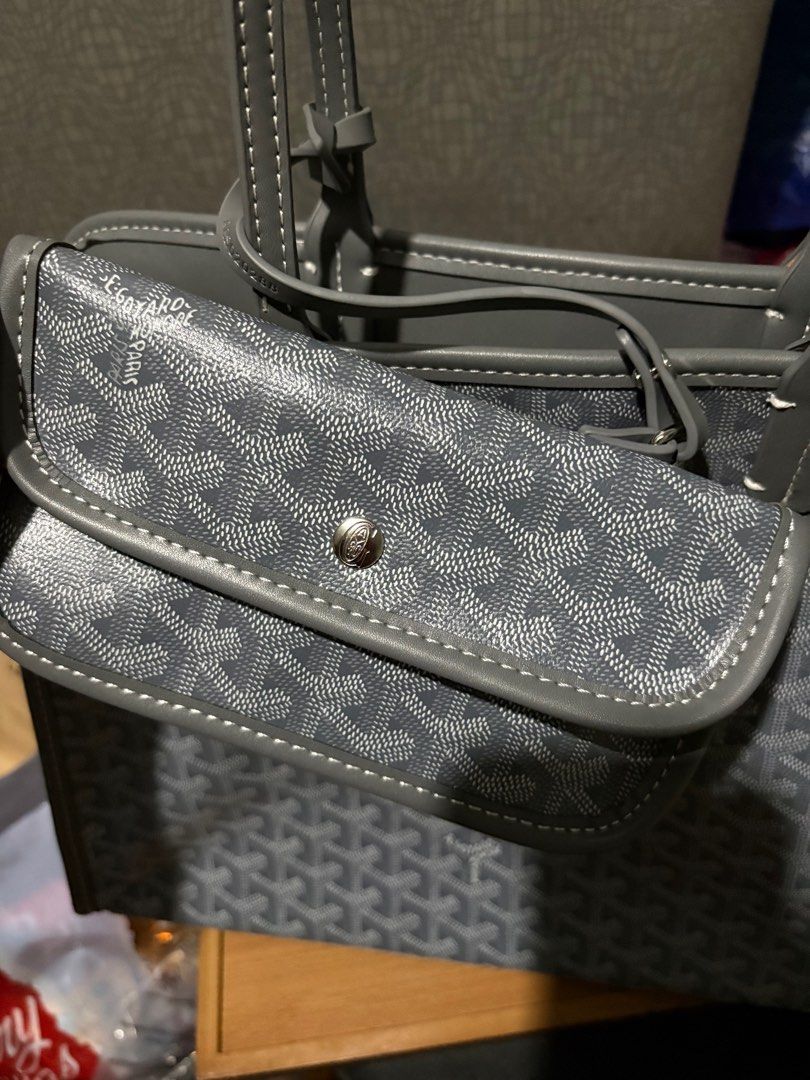 Goyard Grey Tote Bag (Category: Luxury Bags & Wallets) located in Manila. Submitted by louievicocollections (Listing ID 1414659657, Image 3). Description: - Goyard tote bag - Color: Grey - Includes matching pouch with snap closure - Features zip closure - White stitching details - Interior strap with brand name - Classic Goyardine pattern - Spacious interior.