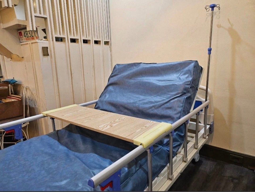 Hospital Bed - Three Cranks (Category: Bed Frames & Mattresses) located in Rizal. Submitted by artandjournals (Listing ID 1414637203, Image 2). Description: For sale: Three-Cranks Hospital Bed (Used Condition) Adjustable head and feet side, adjustable height. With side rails, and food table. May sabitan nang IVs Thick mattress, unlike sa nabibili sa labas. Note: Already assembled. Needs three to four people to carry out of our home. Used conditio