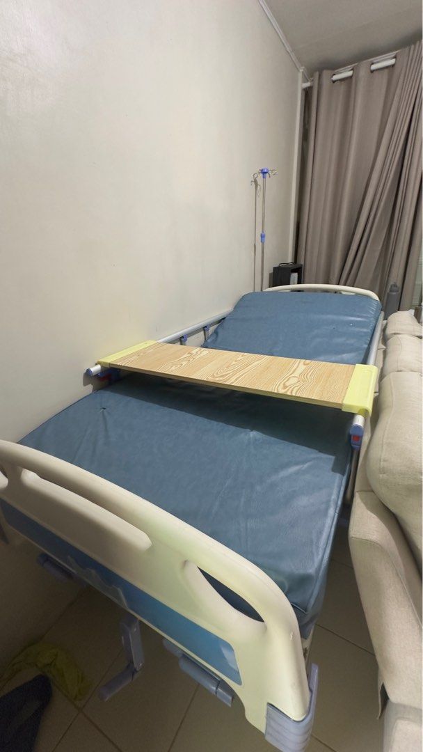 Hospital Bed - Three Cranks (Category: Bed Frames & Mattresses) located in Rizal. Submitted by artandjournals (Listing ID 1414637203, Image 1). Description: For sale: Three-Cranks Hospital Bed (Used Condition) Adjustable head and feet side, adjustable height. With side rails, and food table. May sabitan nang IVs Thick mattress, unlike sa nabibili sa labas. Note: Already assembled. Needs three to four people to carry out of our home. Used conditio