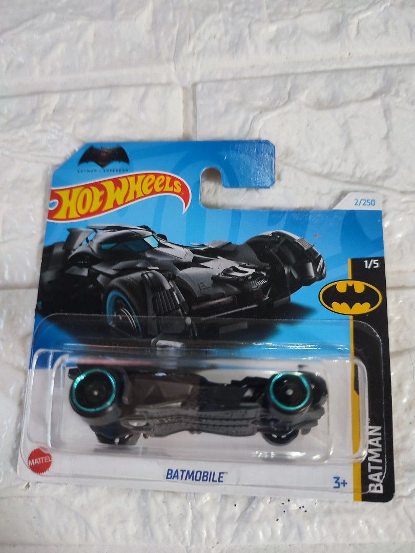 Hot Wheels Batmobile 2024 (Category: Vehicle & Diecast Models) located in Narvacan. Submitted by jigger85 (Listing ID 1414720357, Image 1). Description: - 2024 Hot Wheels Batmobile - 1/5 scale model - Part of the Batman series - Features a black body - Blue accents on wheels - Brand new, still in original packaging - Includes Hot Wheels and Batman logos on packaging.
