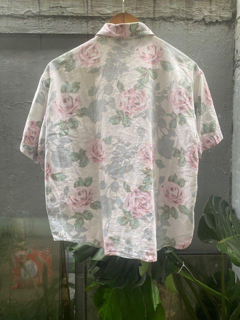 Krazy Kat Floral Shirt - Size S - BUY1TAKE1 (Category: Tshirts & Polo Shirts ) located in Makati City. Submitted by secondhand.bayonets (Listing ID 1414709549, Image 2). Description: - Vintage Krazy Kat shirt - Floral design with pink and green roses - Size: Small - Material: 100% Cotton - Style: Button-down, short sleeves - Features a single chest pocket - Background: White -With tiny small holes on back.