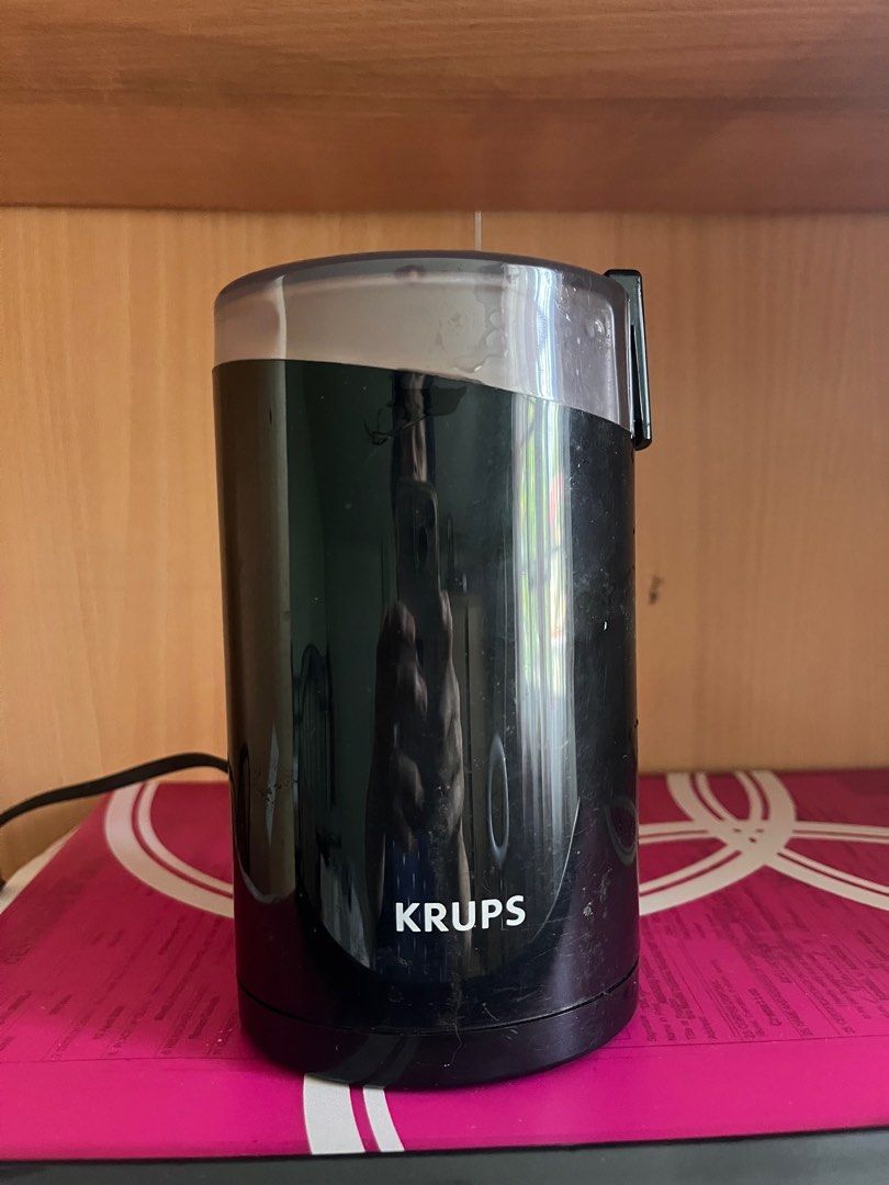 Krups Coffee Grinder (Category: Coffee Machines & Makers) located in Paranaque City. Submitted by HappyPisces (Listing ID 1414758511, Image 1). Description: - Message me for video - Brand: KRUPS - Black exterior - Clear lid - Includes power cord - No issues - Negotiable.