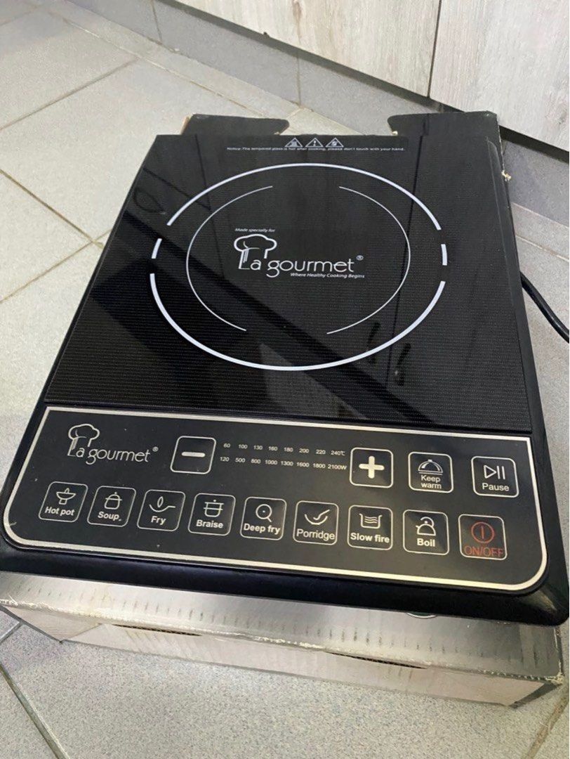 La gourmet Induction Cooker (Category: Cookers) located in Kuala Lumpur. Submitted by janz_trading (Listing ID 1414727274, Image 1). Description: La gourmet induction cooker with multiple cooking functions. Features include hot pot, soup, fry, braise, deep fry, porridge, slow fire, and boil settings. It has a digital display for temperature control and a keep warm function. Comes with an on/off button and a pause function. Includes a power cord..