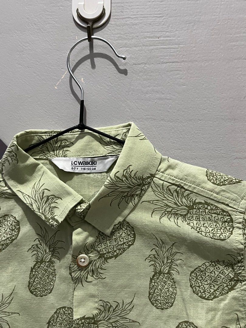 LC Waikiki Pineapple Print Shirt (Category: Babies & Kids Fashion) located in Angono. Submitted by dubibo (Listing ID 1414695305, Image 2). Description: - LC Waikiki shirt - Pineapple print - Size: 6-7 years (116-122cm) - Color: Light green - Features: Short sleeves, button-down front - Ideal for casual outings.