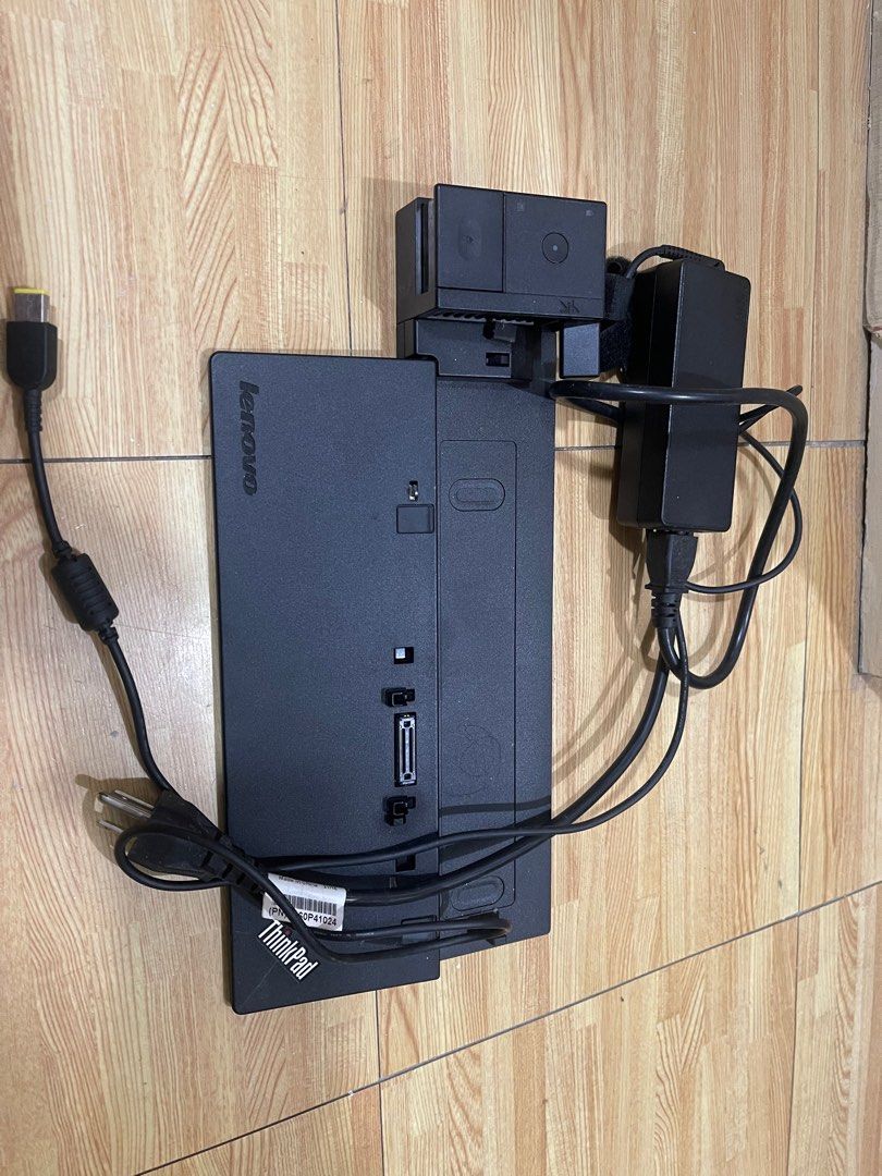 Lenovo ThinkPad Docking Station (Category: Laptops & Notebooks) located in Manila. Submitted by tomtomsworld (Listing ID 1414795529, Image 3). Description: - Lenovo ThinkPad docking station - Includes power adapter and cable - Features multiple ports - Comes with a ThinkPad branded base - Black color.