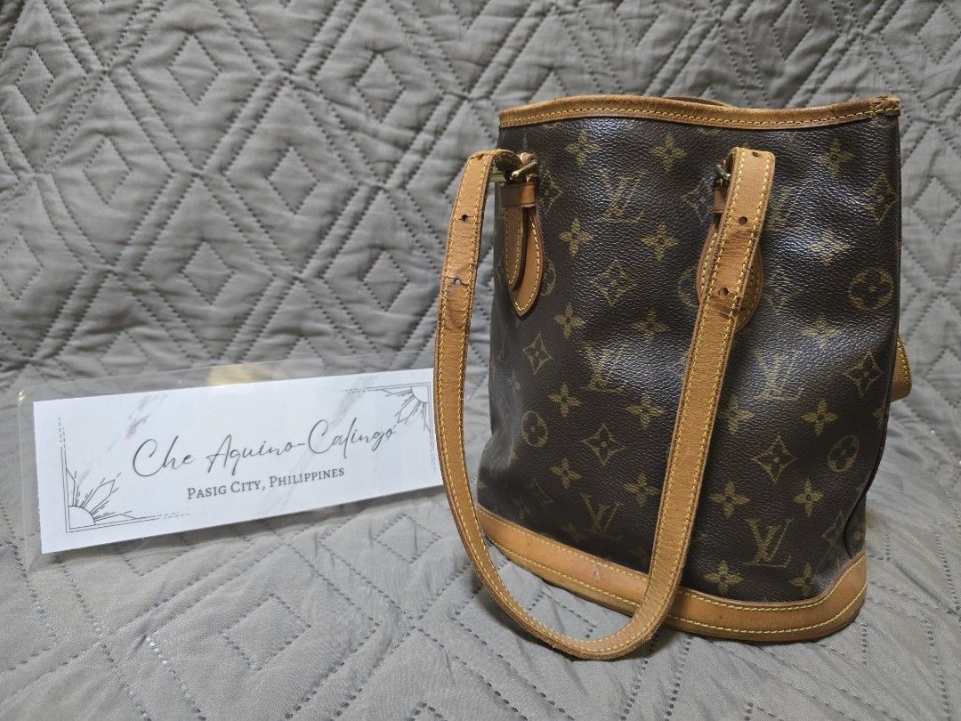 Louis Vuitton Bucket Bag PM (Category: Luxury Bags & Wallets) located in Manila. Submitted by lylmaster (Listing ID 1414799981, Image 3). Description: - Authentic Louis Vuitton bucket bag - Classic monogram canvas - Vachetta leather trim (with cracks and heavy watermark) - Leather-reinforced base.
