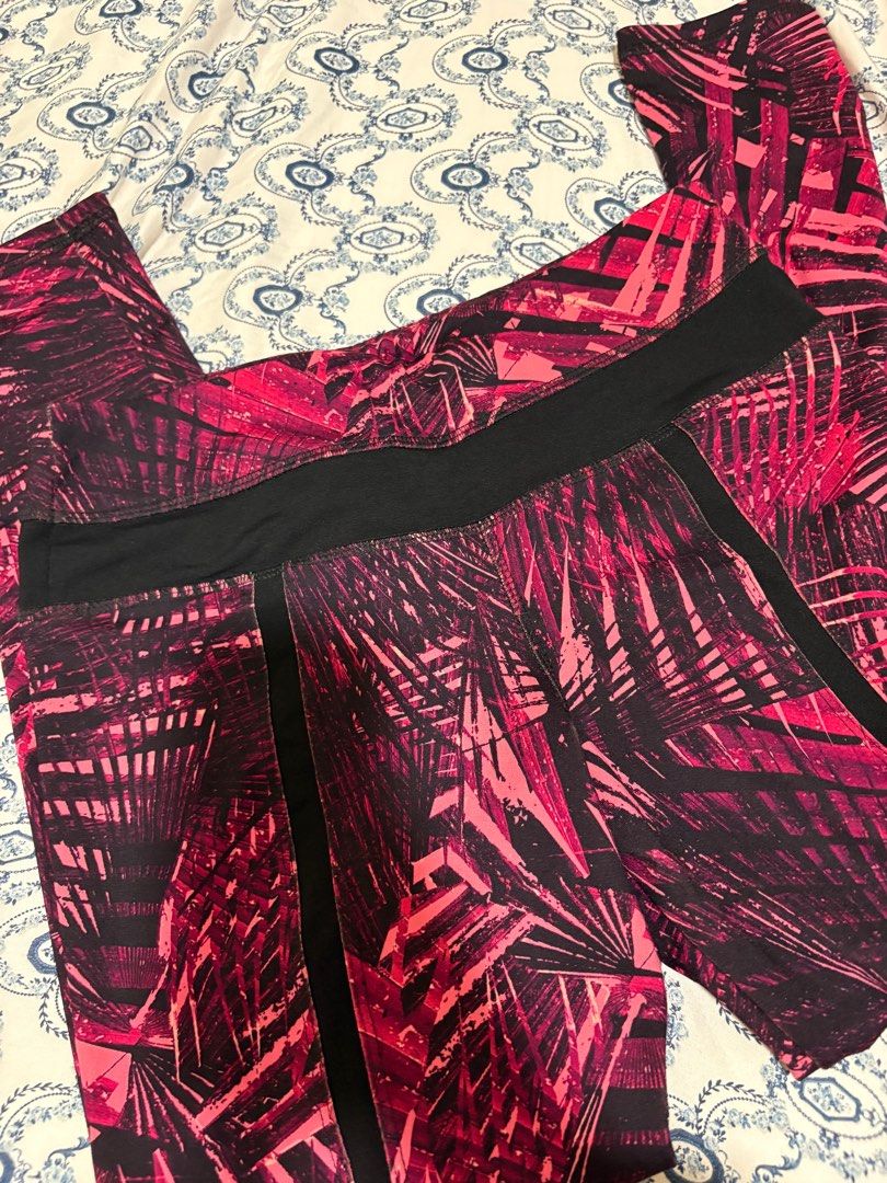 Lululemon Athletica Leggings Size 6 (Category: Activewear) located in Taguig. Submitted by allyjavierv (Listing ID 1414733335, Image 1). Description: - Lululemon Athletica leggings - Vibrant pink and black palm leaf print - Black waistband and side panels - Size: 6 - Designed in Vancouver - Made in Cambodia - Perfect for workouts or casual wear.