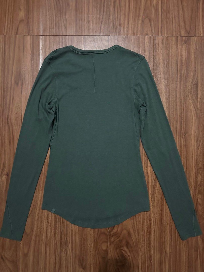Lululemon Green Long Sleeve Shirt (Category: Activewear) located in Bacoor. Submitted by nothanamiii (Listing ID 1414811652, Image 2). Description: - Lululemon long sleeve shirt - Muted green color - Crew neck design - Fitted silhouette - Long sleeves - Curved hemline - Perfect for workouts and casual wear.
