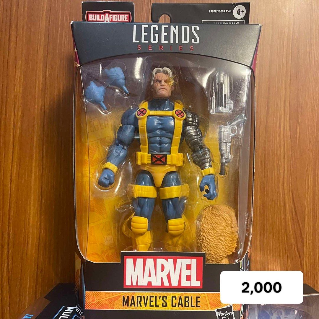 Marvel Legends Series Marvel's Cable Action Figure (Category: Figurines & Statues) located in Santa Rosa. Submitted by fvcam (Listing ID 1414768503, Image 1). Description: - Marvel Legends Series Marvel's Cable action figure - Features Cable's blue and yellow outfit - Includes a metallic arm - Comes with multiple accessories: alternate hands, gun, and hair piece - Figure is in its original packaging (new in box).