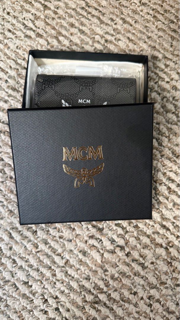 MCM Visetos Card Holder Wallet (Category: Luxury Bags & Wallets) located in Manila. Submitted by Authentic_Seller (Listing ID 1414666046, Image 2). Description: Authentic MCM Visetos card holder wallet Includes original box, dust bag, and tags Features iconic MCM logo and Visetos pattern Multiple card slots can fit up to 10 cards Compartment for money bills.