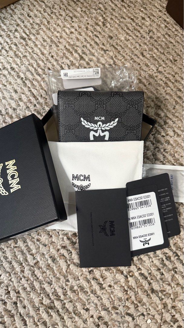 MCM Visetos Card Holder Wallet (Category: Luxury Bags & Wallets) located in Manila. Submitted by Authentic_Seller (Listing ID 1414666046, Image 3). Description: Authentic MCM Visetos card holder wallet Includes original box, dust bag, and tags Features iconic MCM logo and Visetos pattern Multiple card slots can fit up to 10 cards Compartment for money bills.