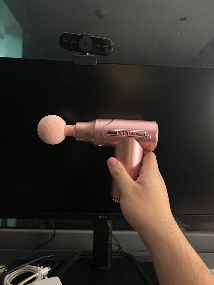 Miniso Massage Gun (Category: Massage Devices) located in Quezon City. Submitted by atienzavee (Listing ID 1414792391, Image 2). Description: Original Miniso massage gun in pink color, like new and barely used. This handheld massage gun is compact, lightweight, and easy to grip, with a round foam massage head as shown in the photo. Miniso branding is visible on the body. Device powers on properly and is suitable for muscle relaxation after workou