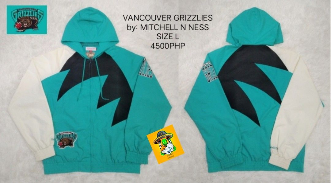 Mitchell & Ness Vancouver Grizzlies Jacket Size L (Category: Coats, Jackets and Outerwear) located in Manila. Submitted by nxone (Listing ID 1414759938, Image 1). Description: Vancouver Grizzlies jacket by Mitchell & Ness. Features a teal, black, and white color scheme with a hood. Includes the Grizzlies logo on the chest and sleeve. Size L. Price is 4500 PHP..