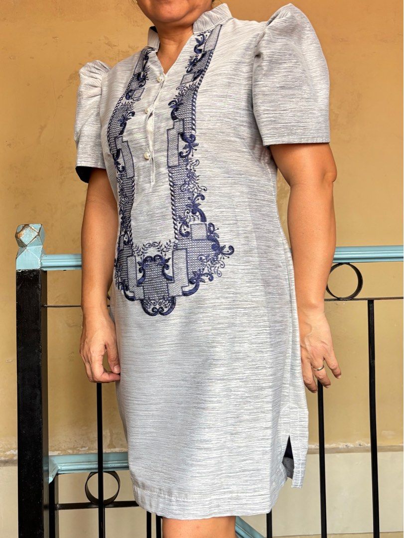 Modern Filipiniana (Gray) (Category: Dresses) located in Santa Rosa. Submitted by wthsofie (Listing ID 1414675299, Image 2). Description: Elegant gray dress with blue embroidery, mandarin collar, short sleeves, and button-down front. Worn once only. Good as new condition. MOP: GCash, MariBank, BDO MOD: J&T, Lalamove (c/o buyer) 📌 Santa Rosa City, Laguna.