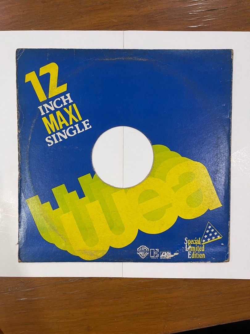 Narada Michael Walden - High Above The Clouds 12" Maxi Single (Category: Vinyls) located in Manila. Submitted by rtvarietystore (Listing ID 1414774809, Image 2). Description: Special edition 12-inch maxi single of Narada Michael Walden's "High Above The Clouds." The record features the song on one side. The cover has a blue background with yellow text and graphics. It includes the Warner Bros. Records and Atlantic Records logos. The record is in 