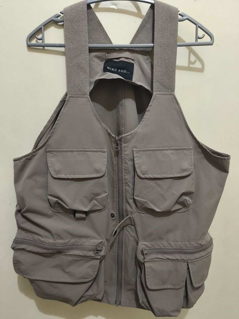 Niko and... Utility Vest (Category: Vests) located in Manila. Submitted by cinnamonboy24 (Listing ID 1414749994, Image 2). Description: - Niko and... utility vest - Only used twice - Multiple pockets for storage - Zip-up closure - Versatile neutral color - Shoulder strap detail - Small button closure - Brand tag visible inside collar.