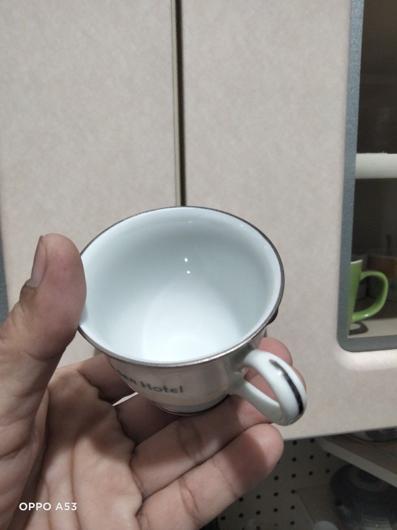 Noritake Manila Garden Hotel Cup (Category: Coffee & Tea Tableware) located in Carmona. Submitted by rpute (Listing ID 1414717749, Image 3). Description: - Vintage cup from the Manila Garden Hotel - Features the hotel's green logo and name - White cup with silver trim - Marked "Contemporary Fine China by Noritake Philippines" - Perfect for collectors of vintage hotel memorabilia.