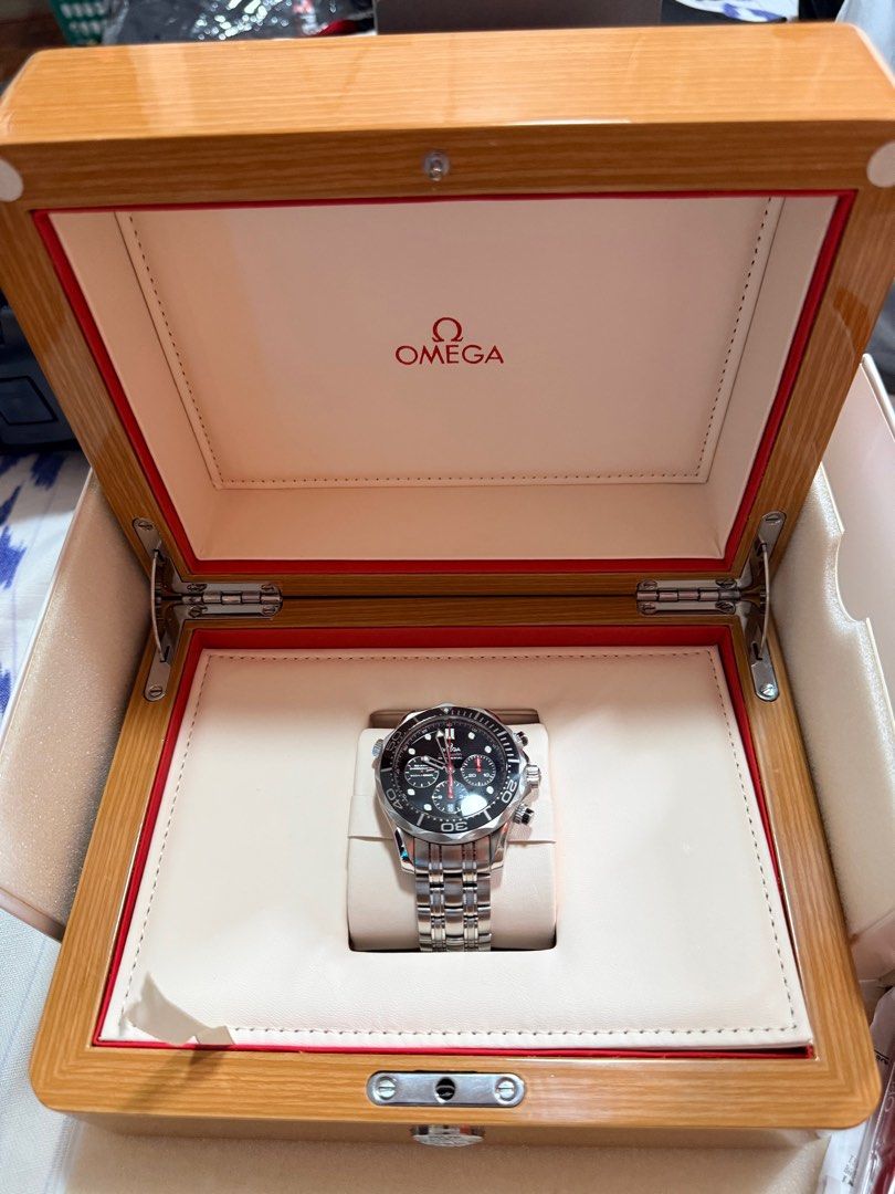 Omega Seamaster Diver 300M Chronograph (Category: Men's Watches) located in Paranaque City. Submitted by greesey3 (Listing ID 1414641324, Image 3). Description: For sale or trade - Omega Seamaster Diver 300M Chronograph - Black dial - Stainless steel bracelet - Includes original box, service and warranty receipt from omega, and operating instructions - Chronograph subdials - Date display - Presented in original wooden box.