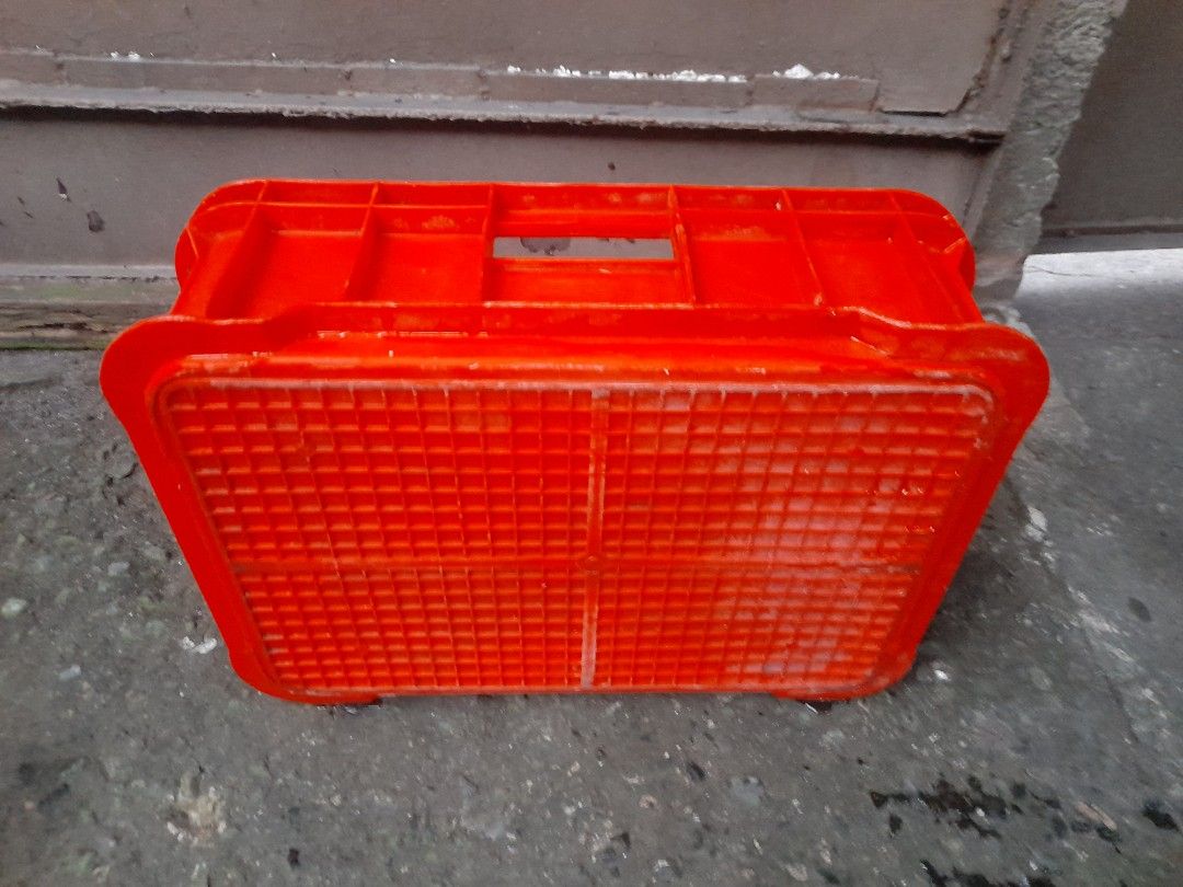 Orange Plastic Storage Box with Handles (Category: Storage Boxes & Baskets) located in Valenzuela. Submitted by newbear.425b6e (Listing ID 1414726747, Image 2). Description: - Durable orange plastic storage box - Built-in handles for easy carrying - Rectangular shape with grid pattern - Smooth interior and sturdy base - Ideal for home or workspace organization -surplus plastic crate 400 each.