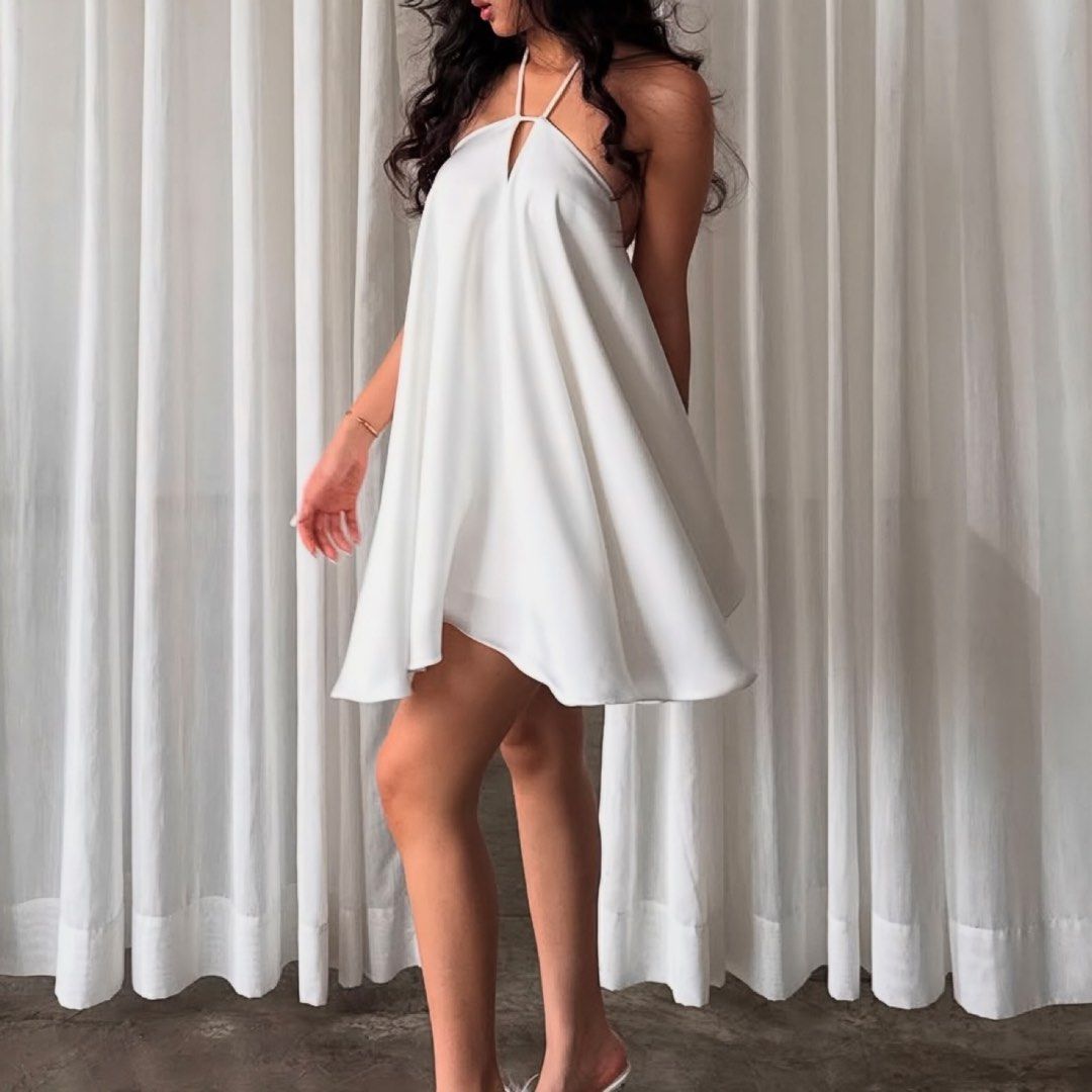 RENT: White Halter Silk Flowy Dress (Category: Dresses) located in Dasmarinas. Submitted by luvhrt (Listing ID 1414695537, Image 2). Description: 💌 Terms and Conditions: • Rental period is 3 days only (1. Pick-up, 2. Day of Use, 3. Return). • A deposit of ₱500 is required upon receiving the dress. This covers minor stains or small damages. • For major damage (tears, burns, irreversible stains), the renter will need to cover the full replacement 