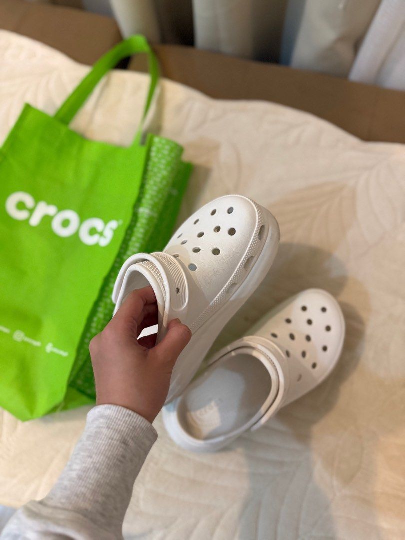 Rush! Crocs Classic Platform Clog White (Category: Slippers and slides) located in Manila. Submitted by hearty.y (Listing ID 1414730399, Image 2). Description: - White Crocs Classic Platform Clogs - Includes original green Crocs shopping bag - Features iconic Crocs comfort - Platform sole - Crocs logo visible - Perfect for casual wear i got it 7,500 3 mons ago. i’m selling it naman for 1,8 super baba na. msg me for more deets. need cash kaya bine