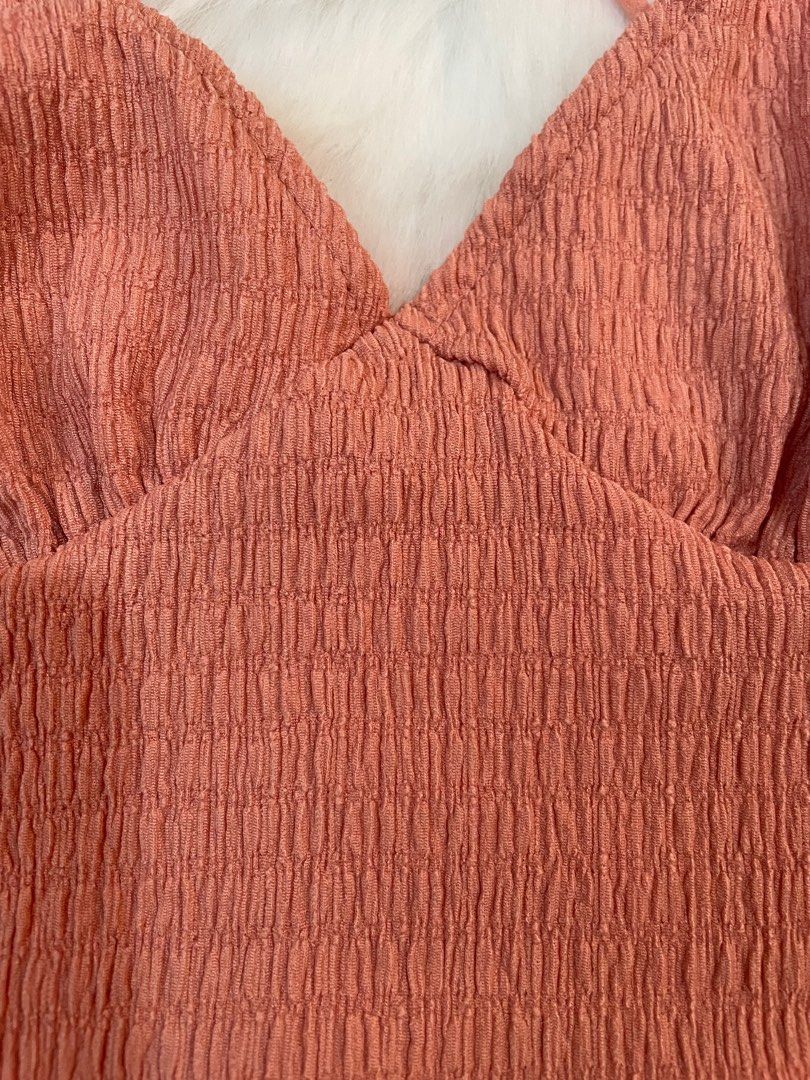 Shein Crisscross Crop Top (Category: Others Tops) located in Manila. Submitted by dbbjll (Listing ID 1414797905, Image 3). Description: - Shein crop top - Size: XS - Design: Crisscross back - Features: V-neck, thin straps - Fabric: Textured - Color: Muted coral/terracotta.