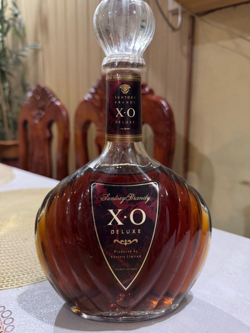 Suntory Brandy X.O Deluxe (Category: Other Food & Drinks) located in Taguig. Submitted by kia______ (Listing ID 1414727086, Image 2). Description: - Suntory Brandy X.O Deluxe - Produced by Suntory Limited - Unique bottle shape - Clear glass stopper - Features Suntory Brandy logo - Sealed bottle.