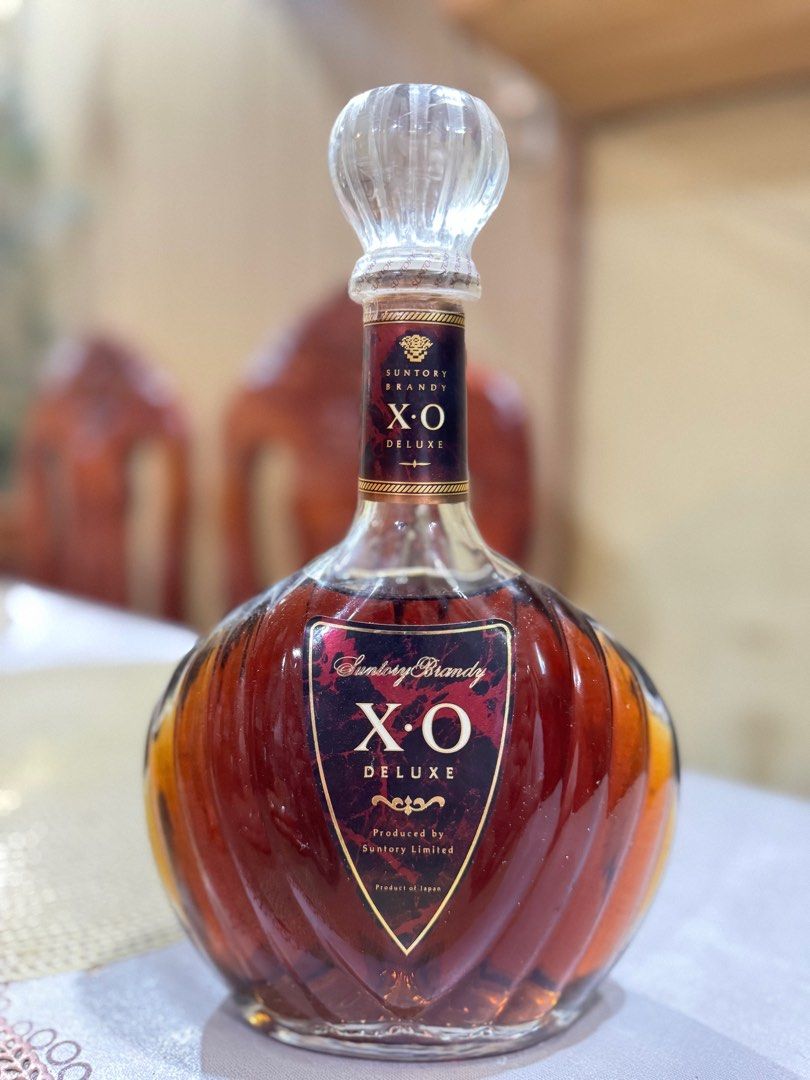 Suntory Brandy X.O Deluxe (Category: Other Food & Drinks) located in Taguig. Submitted by kia______ (Listing ID 1414727086, Image 1). Description: - Suntory Brandy X.O Deluxe - Produced by Suntory Limited - Unique bottle shape - Clear glass stopper - Features Suntory Brandy logo - Sealed bottle.