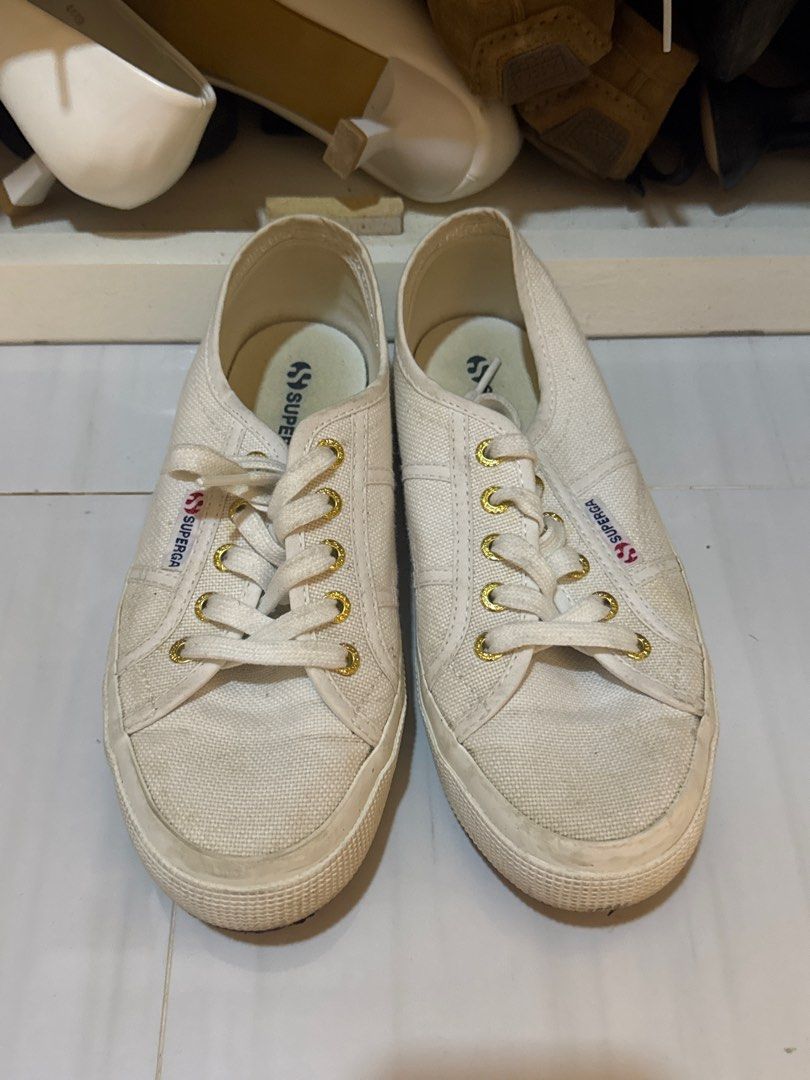 Superga White Canvas Shoes Size 38 (Category: Sneakers) located in Cabanatuan. Submitted by amirdecluttersph (Listing ID 1414725805, Image 1). Description: - Superga white canvas shoes - Size 38 - Classic design with gold eyelets - Features Superga logo - Soles show wear - Perfect for everyday wear Rfs: di na nasusuot.